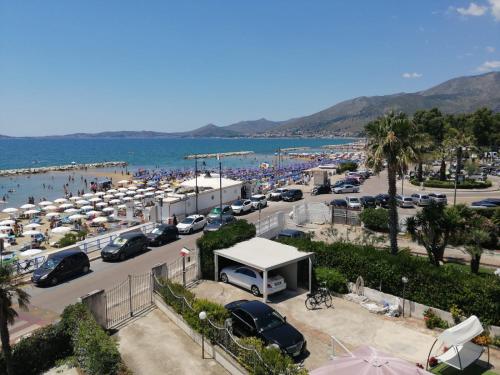 a parking lot at a beach with a lot of cars at Hotel Tirreno Formia in Formia