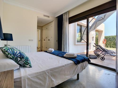 a bedroom with a large bed and a large window at Roda Villa with Pool 0508 in San Javier