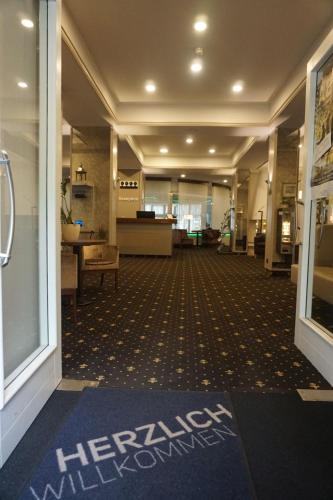 Hotel Am Schloss Aurichのロビーまたはフロント