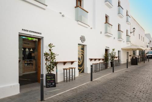 El barrio en el que está el hotel o un barrio cercano