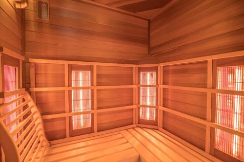 an empty room with wooden walls and windows at Apartment Kornblume - Mesnerhof in Sand in Taufers