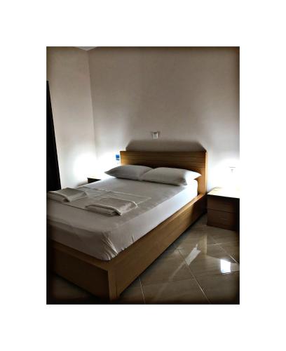 Ένα ή περισσότερα κρεβάτια σε δωμάτιο στο Belvedere Hotel & Suites