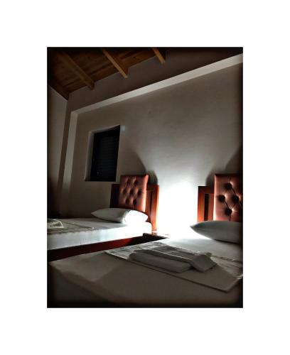 Ένα ή περισσότερα κρεβάτια σε δωμάτιο στο Belvedere Hotel & Suites
