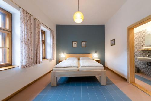 Ένα ή περισσότερα κρεβάτια σε δωμάτιο στο Dům Přátel Pavlova