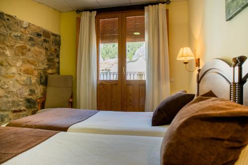 Hotel Casa Palacio tesisinde bir odada yatak veya yataklar