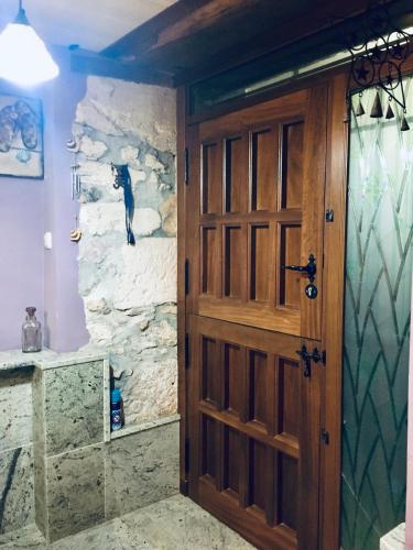 a door in a room with a cat on the wall at Casa Berganzo, Rioja Alavesa in Berganzo