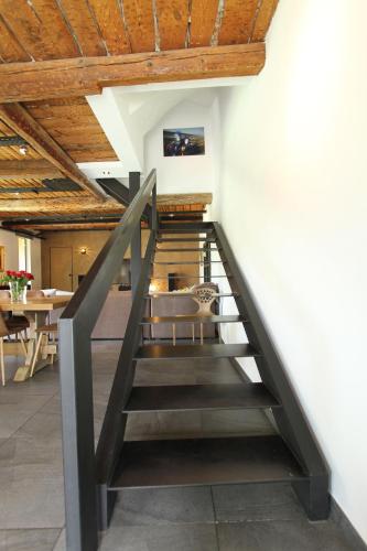 a staircase leading to the second floor of a house at Maison avec piscine et jardin- 4 chambres 8 pers in Cuers