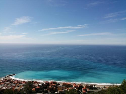 an aerial view of a beach and the ocean at La vie est belle in Finale Ligure