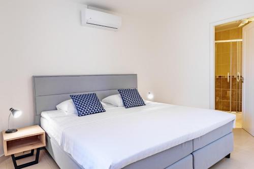 Ένα ή περισσότερα κρεβάτια σε δωμάτιο στο Bellevue Beach Apartment 5