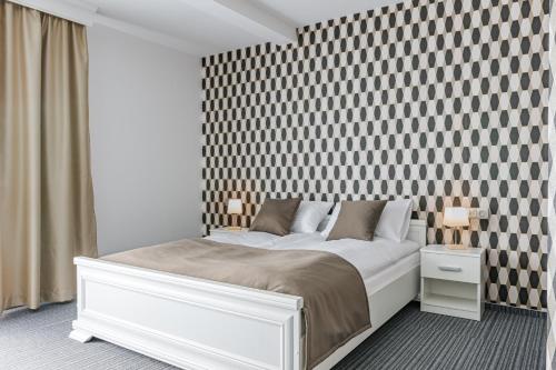 Postel nebo postele na pokoji v ubytování Jeleń Resort&Spa