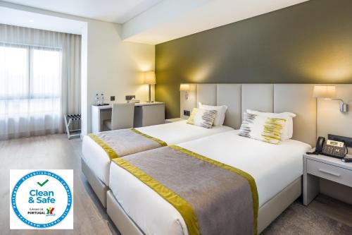 Voodi või voodid majutusasutuse Empire Lisbon Hotel toas