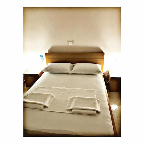 Ένα ή περισσότερα κρεβάτια σε δωμάτιο στο Belvedere Hotel & Suites