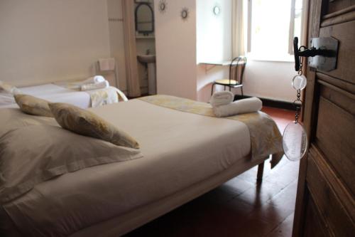 a bedroom with two beds and a window at Les saladelles in Salin-de-Giraud