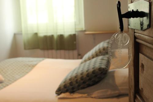 a bedroom with a bed with a thermometer on it at Les saladelles in Salin-de-Giraud