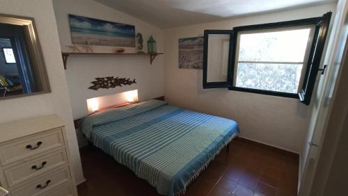 Ένα ή περισσότερα κρεβάτια σε δωμάτιο στο Villino Marzellinu Belvedere