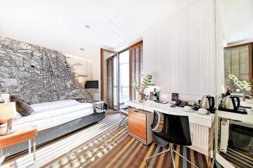 a bedroom with a bed and a desk at Bayjonn Boutique Hotel in Sopot