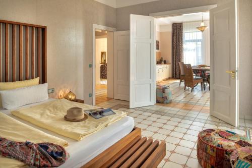 En eller flere senge i et værelse på Recknitztal-Hotel Marlow