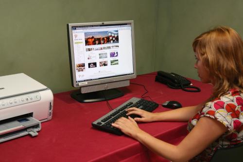 a woman sitting at a desk with a computer at F&G Logroño in Logroño