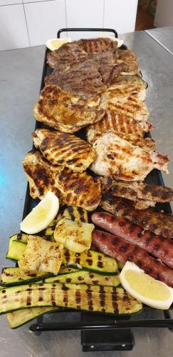 a bunch of different types of food on a grill at Hotel Sant'Ilario in Rovereto