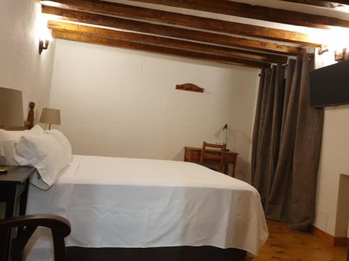 Katil atau katil-katil dalam bilik di Hotel Labranza