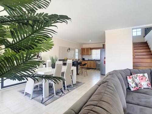 a living room with a couch and a table at Casa Mes Amis by LovelyStay in Relógio do Poiso