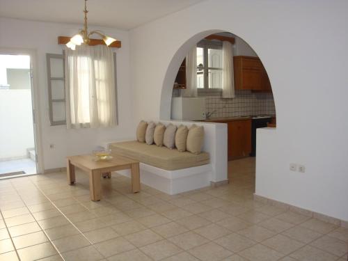 a living room with a couch and a table at 'Naxian family apartment' in Naxos Chora
