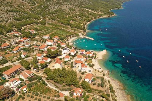 an aerial view of a village on the shore of the ocean at Pansion Jakas in Zavala