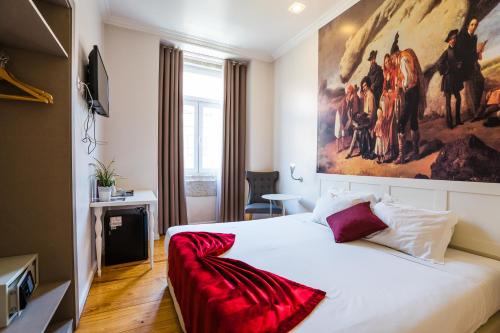 Postel nebo postele na pokoji v ubytování Lisbon Arsenal Suites