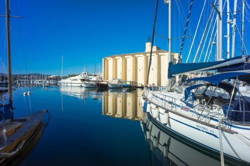 a group of boats are docked in a marina at Residence Le Suffren in Grimaud