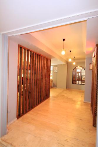 an empty hallway with wooden partitioning in a room at Olimpia Hotel in Fethiye