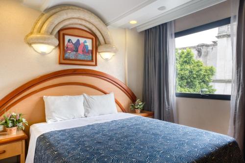 Ένα ή περισσότερα κρεβάτια σε δωμάτιο στο Hotel Diligencias