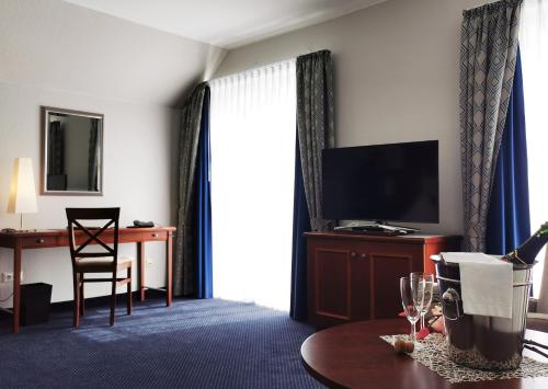 TV a/nebo společenská místnost v ubytování Hotel Garni Bendiks