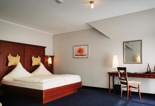 Ένα ή περισσότερα κρεβάτια σε δωμάτιο στο Hotel Garni Bendiks