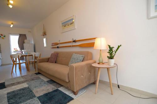 a living room with a couch and a table at Seaside Apartments Malta Sliema 1 in Sliema