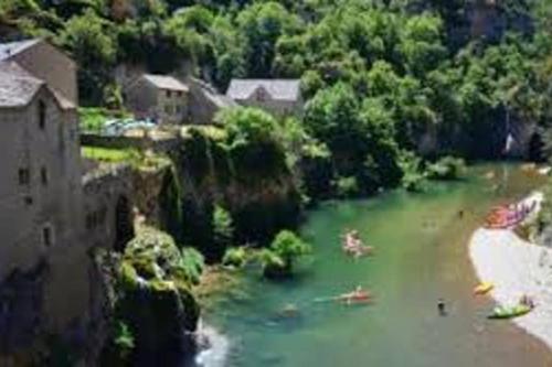 an aerial view of a river with people in it at studio meublé dans maison de village in Balsièges