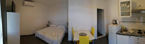 Katil atau katil-katil dalam bilik di Apartmani Skalinada