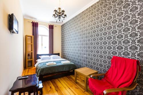 Ένα ή περισσότερα κρεβάτια σε δωμάτιο στο Подобово у Львові, на вулиці Краківській 26 біля Добробуту центр