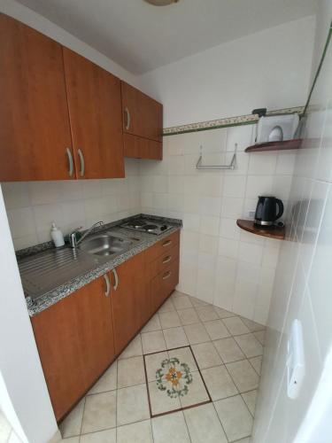 a small kitchen with a sink and a stove at Villa Celentano in Positano