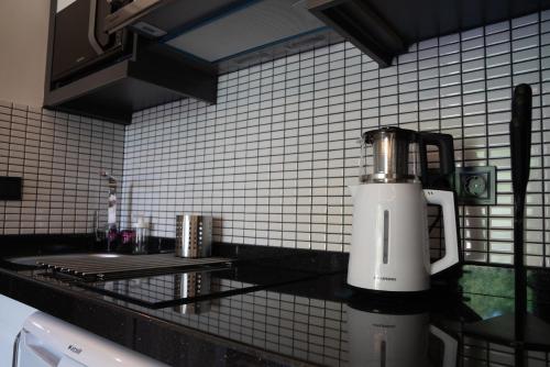 a blender sitting on a counter in a kitchen at Camyuva Beach Hotel in Kemer