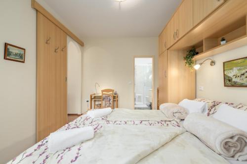 a bedroom with two beds in a room at Apartments Nono in Poreč