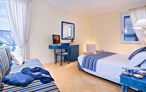 Ένα ή περισσότερα κρεβάτια σε δωμάτιο στο Hotel Mare Blu Terme