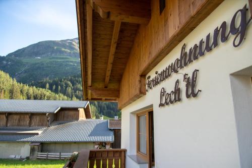a sign on the side of a building at Ferienwohnung Lech'tl in Steeg