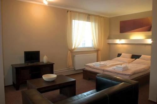 Postel nebo postele na pokoji v ubytování Hotel Galileo