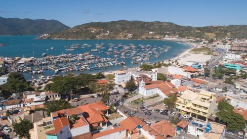 an aerial view of a harbor with boats in the water at Costa Dourada Pousada in Arraial do Cabo