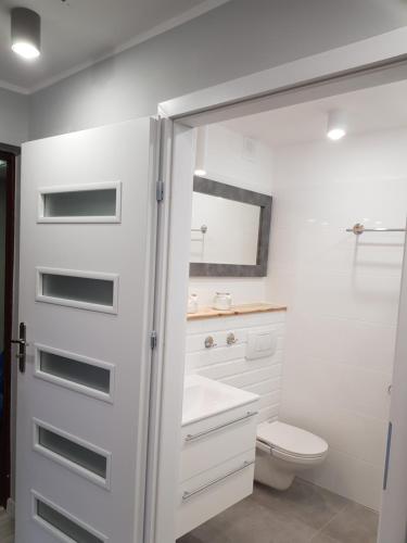 Et badeværelse på Apartament 3 Pokojowy Polonia na wyłączność