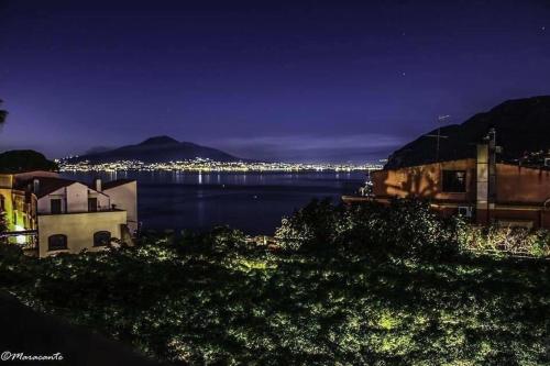 a view of a body of water at night at Aequa Hotel in Vico Equense