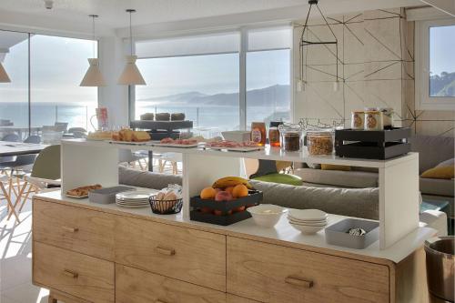 a kitchen with a buffet with food on it at Ameztoi Experience in Getaria
