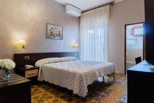 Кровать или кровати в номере Hotel Riviera