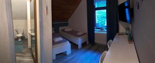 a small room with a bed and a window at Ubytování na Lesní in Luhačovice
