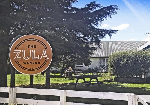 a sign for the zukaarmaarmaarmaarmaarmaarmaarmaarmaarma at Zula Lodge in Wanaka